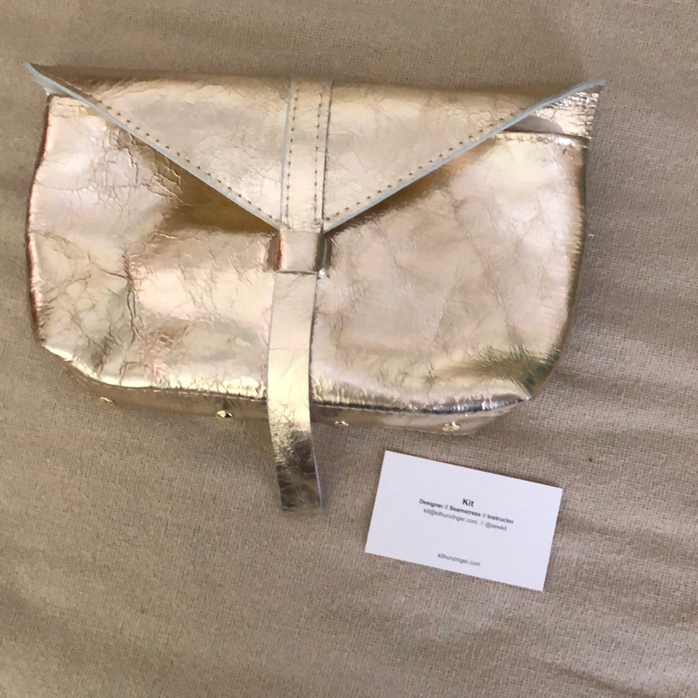 Metallic gold clutch